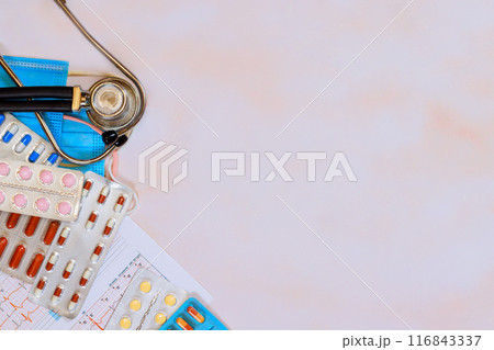 Upon examination electrocardiogram, cardiologist prescribes appropriate medication for treatment of heart condition 116843337