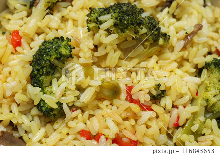 Pilaf, spices, vegetables and glasses of water on white background, top view 116843653