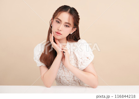 Beautiful young asian woman with clean fresh skin on beige background, Face care, Facial treatment, Cosmetology, beauty and spa, Asian women portrait. 116844218