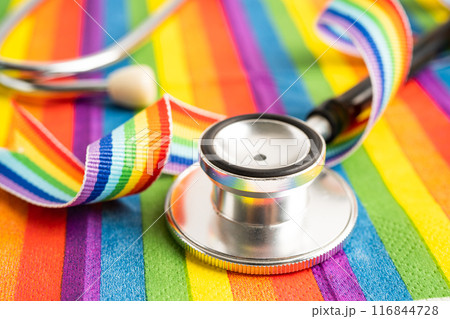 Stethoscope on rainbow flag background, symbol of LGBT pride month celebrate annual in June social, symbol of gay, lesbian, bisexual, transgender, human rights and peace. Stethoscope on rainbow flag background, symbol of LGBT pride month celebrate annual in June social, symbol of gay, lesbian, bisexual, transgender, human rights and peace. 116844728