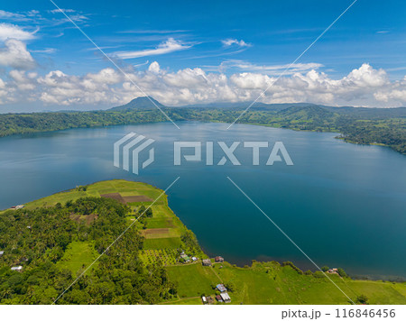 Agricultural land with rice fields and Lake Dapao in Mindanao, Philippines. Travel concept. 116846456