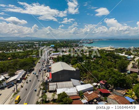 Flying from above view of General Santos City. Cityscape. Mindanao, Philippines. 116846459