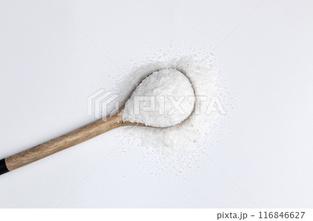 salt in wooden spoon isolated on white background 116846627