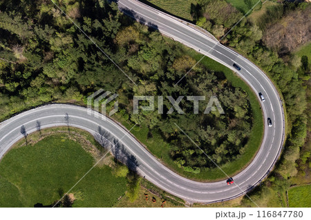 Mountain road, linked curves seen from the air with a drone Mountain road, linked curves seen from the air with a drone 116847780