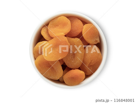 Ceramic bowl with dried soft orange healthy apricots isolated on white background. Ceramic bowl with dried soft orange healthy apricots isolated on white background. 116848001