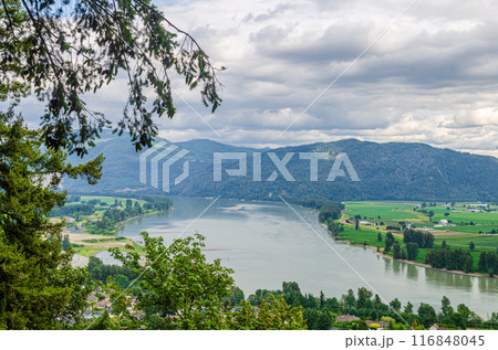 View of the Mission town with Fraser River, lush green valley and the mountains in the background - Fraser Valley, BC, Canada 116848045