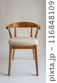 Wooden Chair with a White Cushion 116848109