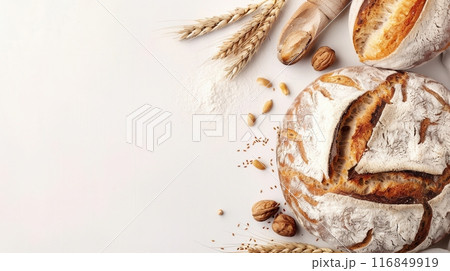 A freshly baked bread loaf with wheat flour on a white background. Generative AI 116849919