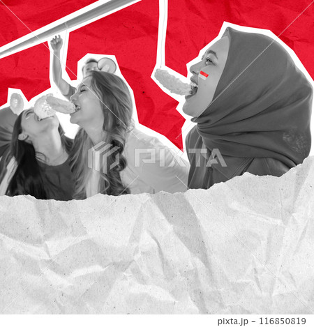 A woman with a scarf on her head playing an eating crackers contest 116850819