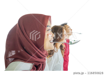 Three people with spoons are marble racing, one of them is wearing a red scarf 116850828
