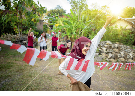A group of people are playing a game of flag race 116850843