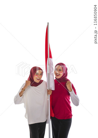 Portrait of two women with excited expressions holding Indonesian flags together 116850904