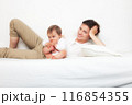 Mother playing with baby on white 116854355