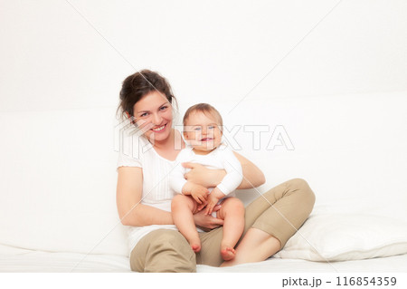 Mother playing with baby on white 116854359