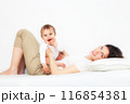 Mother playing with baby on white 116854381