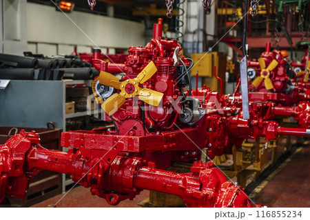 Tractor industry manufacture. New tractors on factory line. Production of agricultural machinery Tractor industry manufacture. New tractors on factory line. Production of agricultural machinery 116855234