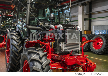Tractor industry manufacture. New tractors on factory line. Production of agricultural machinery 116855266