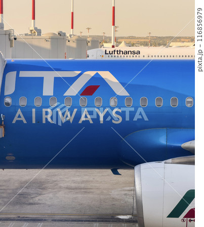 Airplanes from Ita Airways and from Lufthansa on the airport runway 116856979