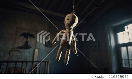 A voodoo doll hanging in a haunted house 116859053