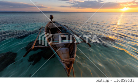 Abandoned Boat on Clear Tropical Waters at Sunset 116859533