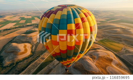Colorful Hot Air Balloon Over Fields Colorful Hot Air Balloon Over Fields 116859695