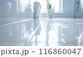 The bathroom floor is sparkling clean, Shiny white bathroom floor. 116860047