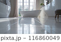The bathroom floor is sparkling clean, Shiny white bathroom floor. 116860049