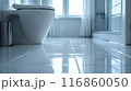 The bathroom floor is sparkling clean, Shiny white bathroom floor. 116860050