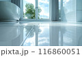 The bathroom floor is sparkling clean, Shiny white bathroom floor. 116860051