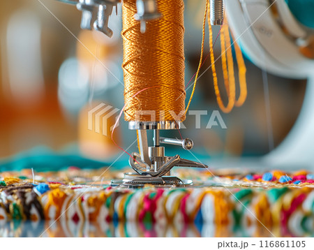 Sewing Machine Embroidering Colorful Patterned Fabric, a close-up view of a sewing machine in action 116861105
