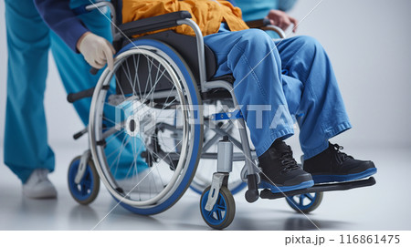 Medical Staff Assisting Patient in Wheelchair Medical Staff Assisting Patient in Wheelchair 116861475
