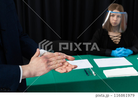 Men's hands thoroughly disinfected before joining the election commission during the presidential election. 116861979