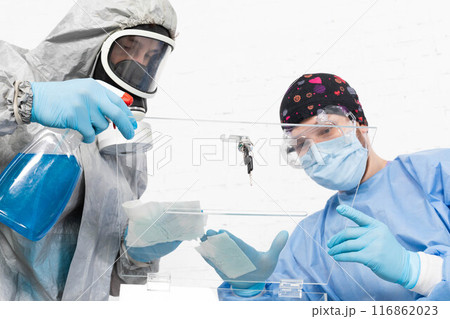 Two employees disinfect the ballot box before the presidential election in Poland. Two employees disinfect the ballot box before the presidential election in Poland. 116862023
