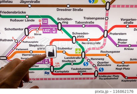 Vienna, Austria, August 21, 2022. Conceptual shot with subway map and finger pointing at cathedral symbol in Stephansplatz. Travel lifestyle. Vienna, Austria, August 21, 2022. Conceptual shot with subway map and finger pointing at cathedral symbol in Stephansplatz. Travel lifestyle. 116862176