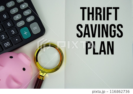 Thrift savings plan text message written on note page with calculator, piggy bank and magnifying glass 116862736