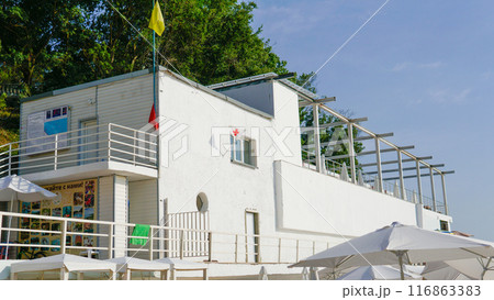 wind symbol red water flagpole sign cross emblem coast banner sea sky white 116863383