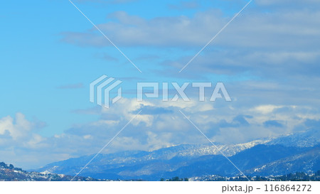 Mountains With Snow-Capped Peaks. Calm Natural Background. Blue Sky Over Hills. Timelapse. Mountains With Snow-Capped Peaks. Calm Natural Background. Blue Sky Over Hills. Timelapse. 116864272