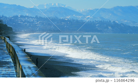 Pebble beach, surf. City embankment illuminated by lanterns. Kobuleti, Adjara, Georgia. Pebble beach, surf. City embankment illuminated by lanterns. Kobuleti, Adjara, Georgia. 116864296
