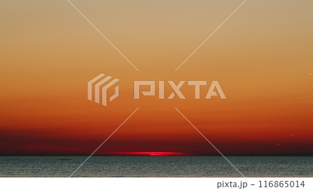 Sunrise Or Sunset In Seaside Beautiful. Beautiful Golden Orange Sunset Over Ocean. Slow motion. 116865014