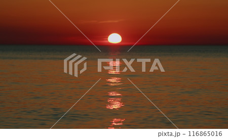 Concept - Vacation And Relax. Sea Surface At Sunset. Summer Landscape. Orange Sea At Sunset. Slow motion. 116865016