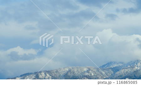Nature Background. Snowy Mountain Top With A White Clouds Moving In With Blue Sky In The Background. Timelapse. 116865085