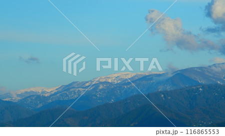 Dramatic Colorful Clouds Over Blue Hills. Landscape With Fog In Mountains And Rows Of Trees. Dramatic Colorful Clouds Over Blue Hills. Landscape With Fog In Mountains And Rows Of Trees. 116865553