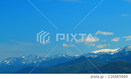 Snowy Mountains And Hills. Mountain Landscape. Mighty Clouds In Mountains At A Spring Day. Real time. 116865660