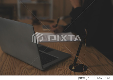 Judge gavel with Justice lawyers having team meeting at law firm background. Concepts of Law and Legal services. 116870858