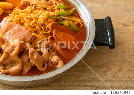 Budae Jjigae or Budaejjigae (Army stew or Army base stew). It is loaded with Kimchi, spam, sausages, ramen noodles and much more 116871947