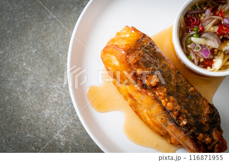 fried snapper fish with fish sauce and spicy salad fried snapper fish with fish sauce and spicy salad 116871955