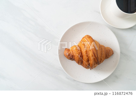 fresh croissant on white plate 116872476