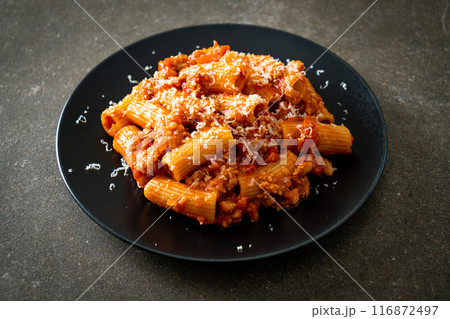 Rigatoni pasta bolognese with cheese 116872497