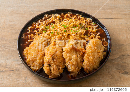 Korean instant noodles with fried chicken or Fried chicken ramyeon Korean instant noodles with fried chicken or Fried chicken ramyeon 116872606