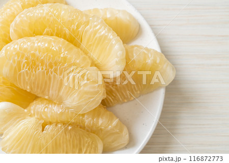 Fresh peeled pomelo, grapefruit or shaddock 116872773